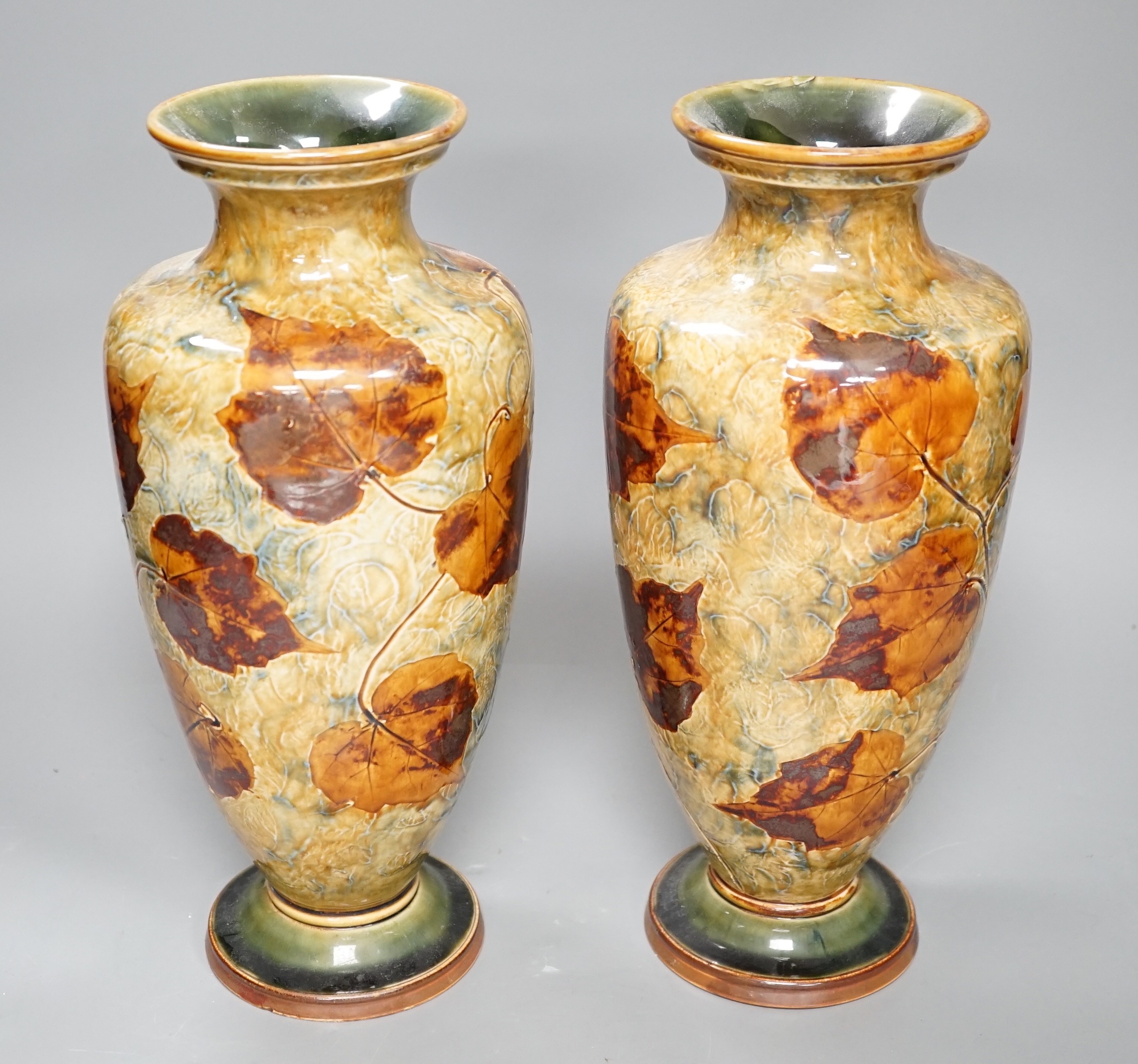 A pair of Doulton stoneware leaf pattern vases, c.1930, 31cm